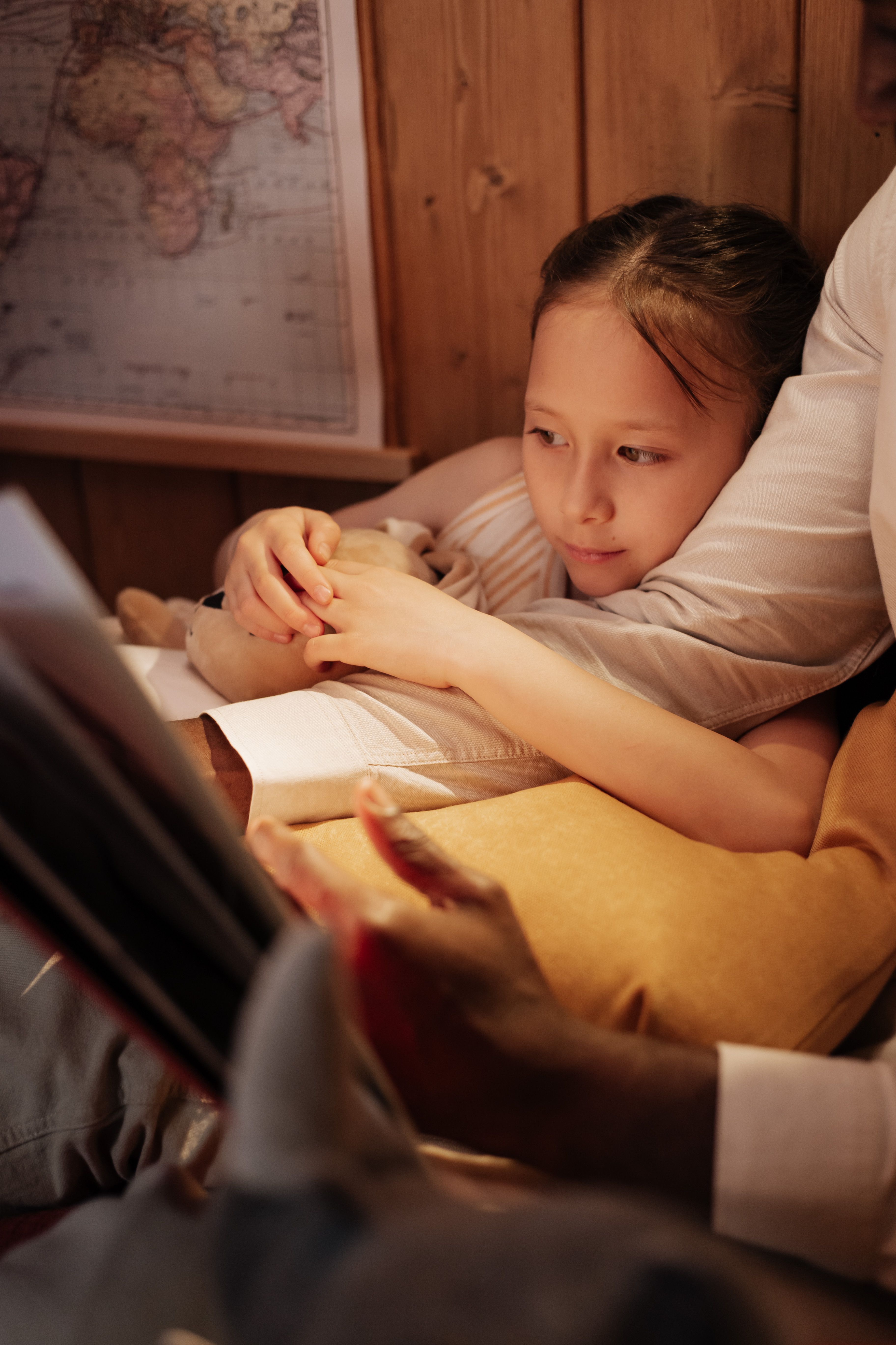 A parent and child reading a story together